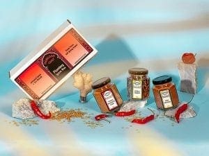 Flaming Spice Box showing jars - Tobago Habanero Curry, Kerala Chaunk, and Goan Vindaloo